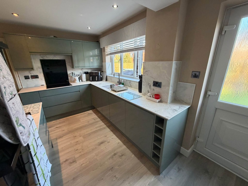 Sage Green Kitchen with Custom Built-in Wine Rack