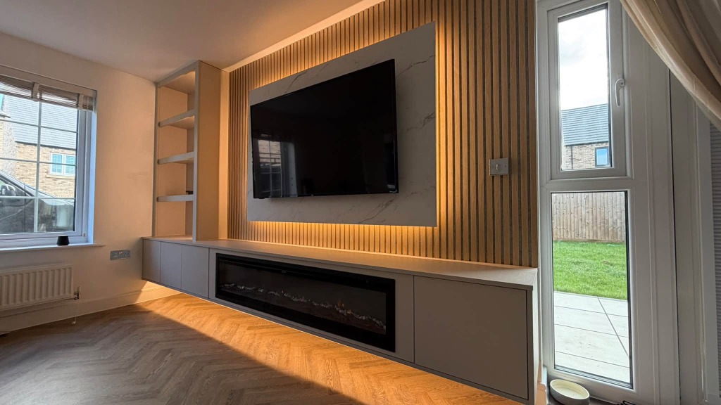 Scandinavian Oak Slat Media Wall with Fireplace
